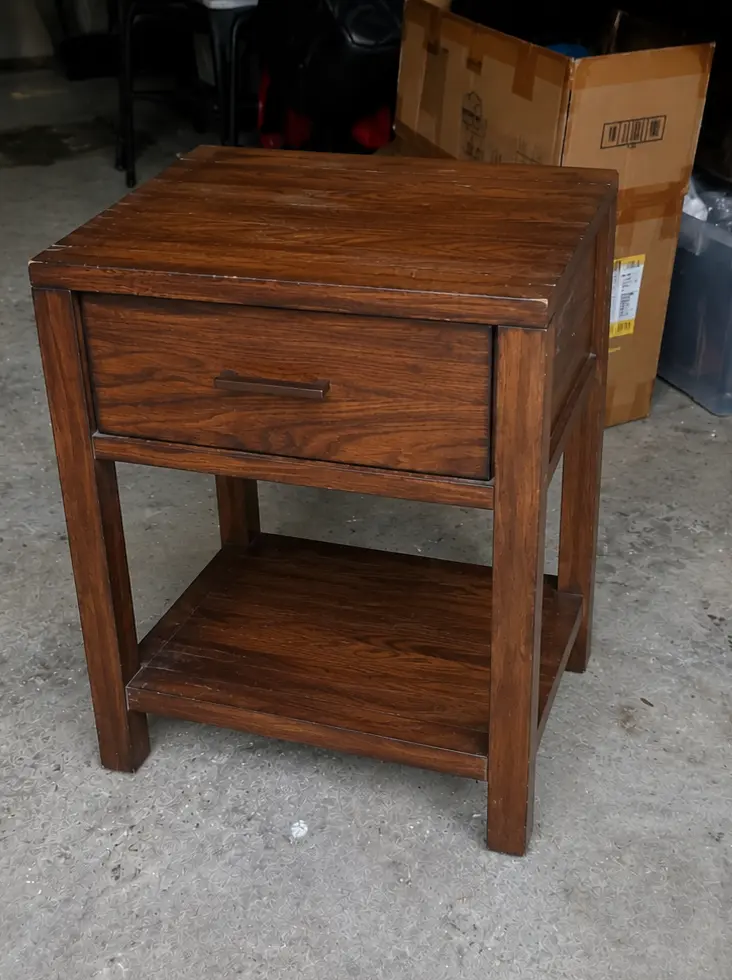 Unedited solid wood side table photo before ListingPack AI cleanup